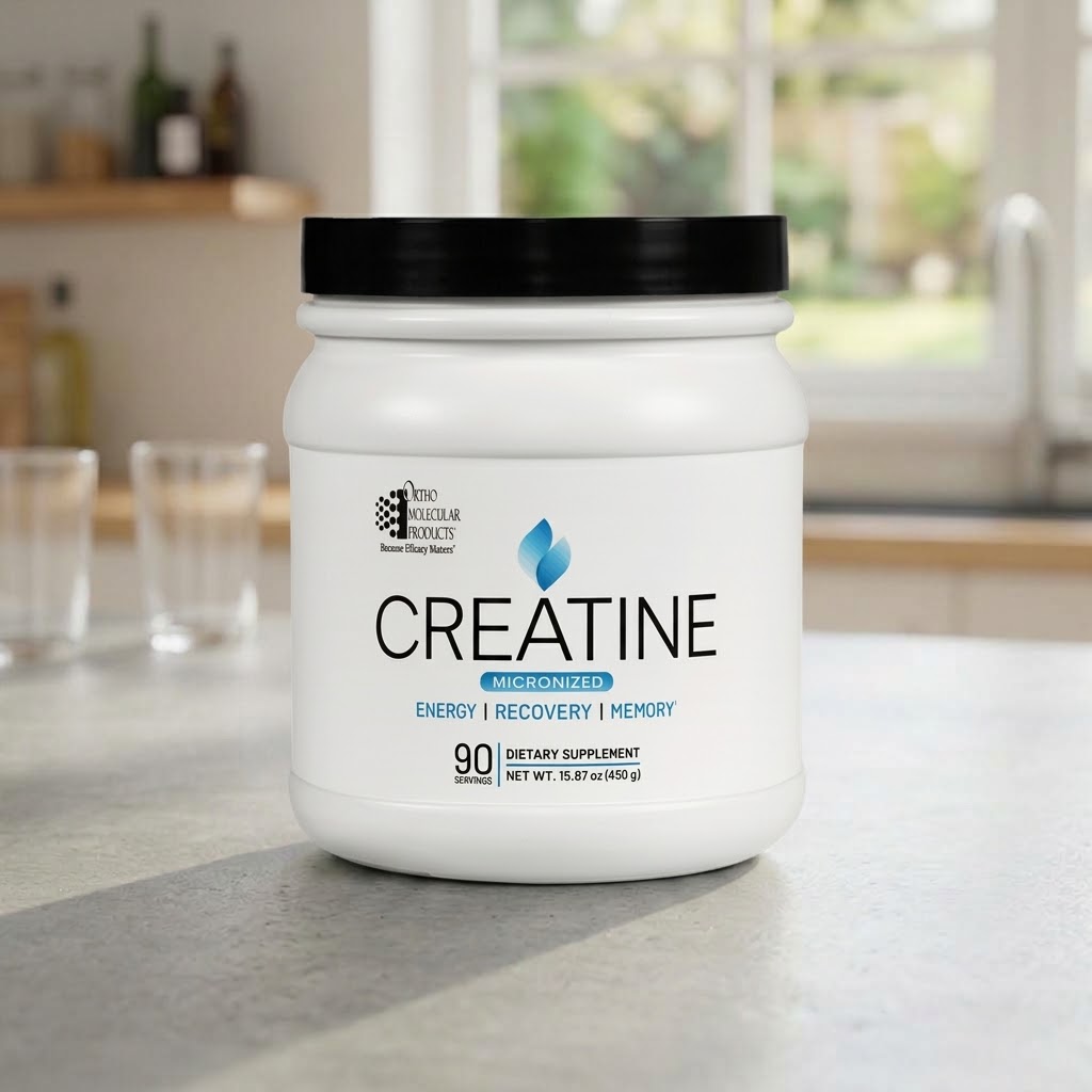 Ortho Molecular Creatine white jar with black lid on a kitchen counter in natural light